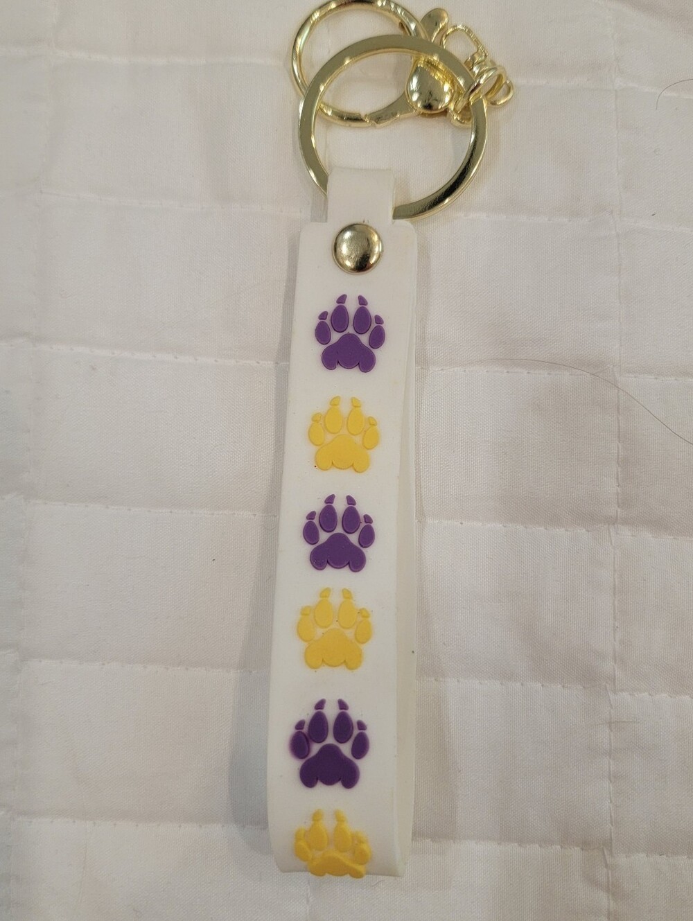 purple and yellow dog paw print keychain